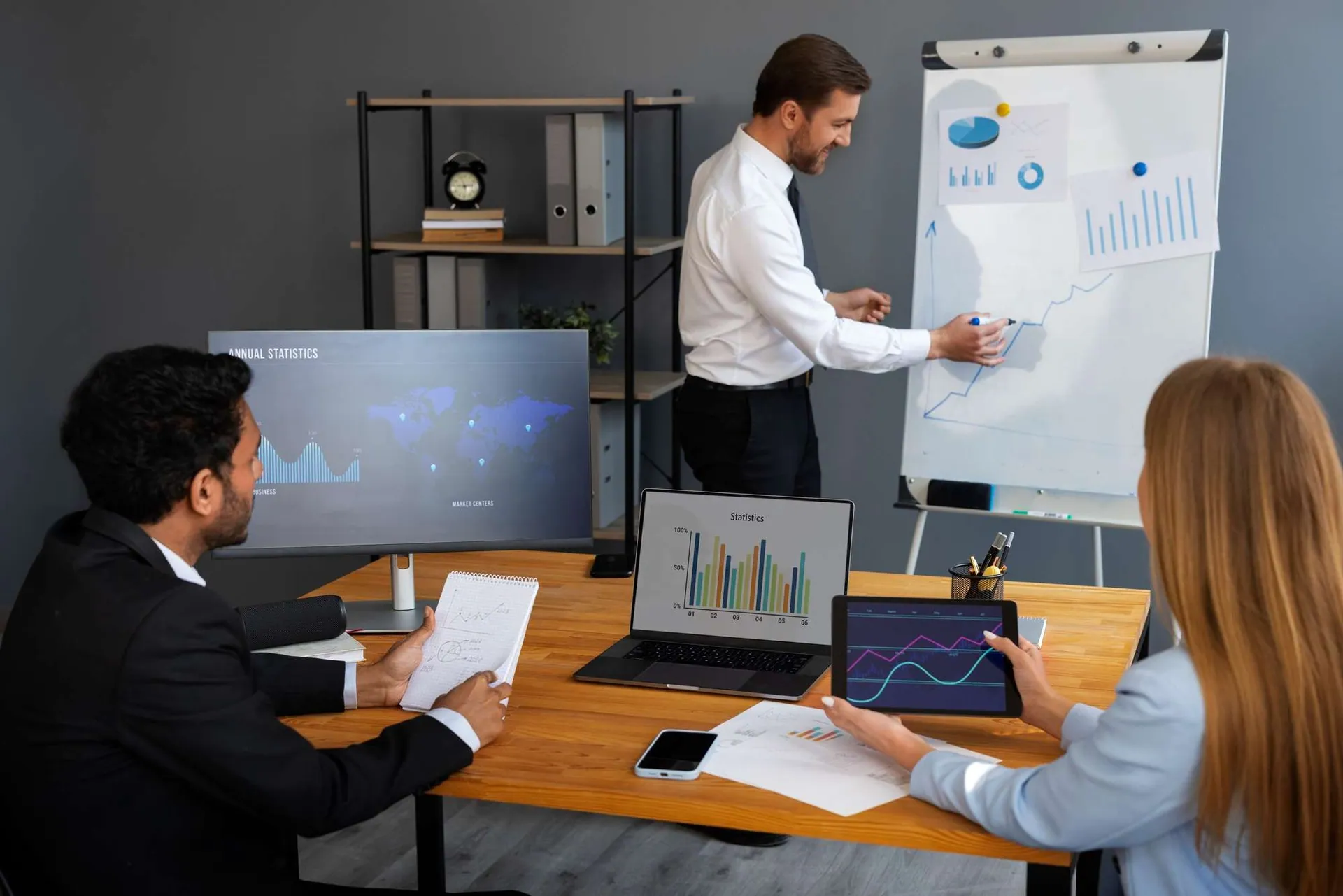 Team analyzing charts and data in a business meeting, identifying areas for operational improvement
